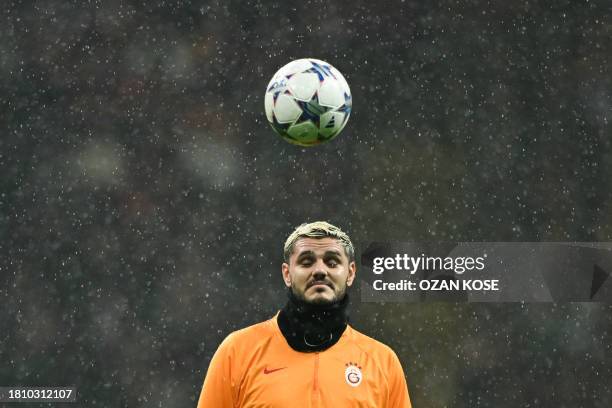 Galatasaray's Argentine forward Mauro Icardi heads the ball ahead of the UEFA Champions League 1st round, day 5, Group A football match between...