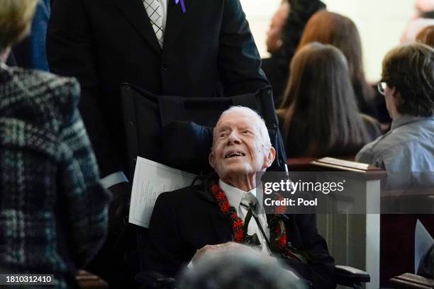 Former President Jimmy Carter greets people as he leaves after the funeral service for his wife, former first lady Rosalynn Carter, at Maranatha...