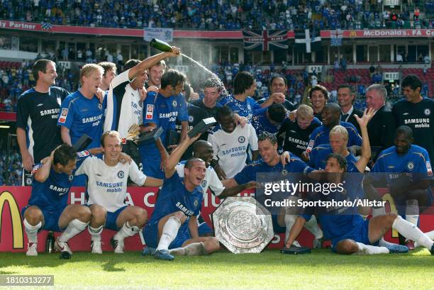 August 7: Chelsea players celebrate with the Trophy after the FA Community Shield match between Arsenal and Chelsea at the Millennium Stadium on...