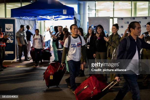November 2023, Israel, Ramle: Thai migrant workers, who were released by the militant group Hamas after being in captivity for over 50 days, board a...