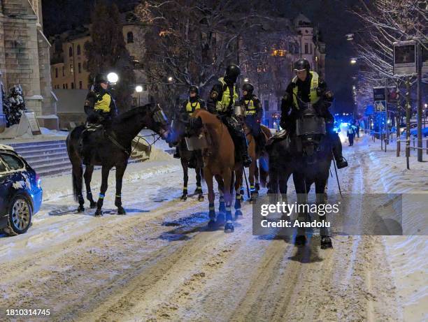 Mounted police take measures as people, holding banners and Palestinian flags, gather to stage protest against Israeli attacks on Gaza on November...