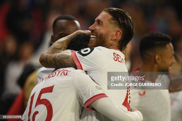 Sevilla's Moroccan forward Youssef En-Nesyri celebrates scoring the second goal with Sevilla's Spanish defender Sergio Ramos during the UEFA...