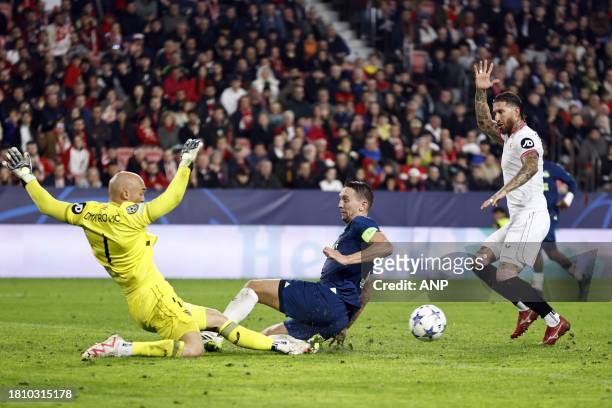 Sevilla FC goalkeeper Marko Dmitrovic, Luuk de Jong of PSV Eindhoven, Sergio Ramos of Sevilla FC during the UEFA Champions League group B match...