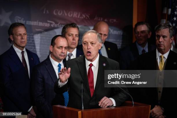 At center, Rep. Andy Biggs speaks during a news conference with members of the House Freedom Caucus at the U.S. Capitol November 29, 2023 in...