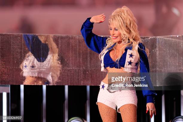 Dolly Parton performs during halftime in the game between the Washington Commanders and the Dallas Cowboys at AT&T Stadium on November 23, 2023 in...
