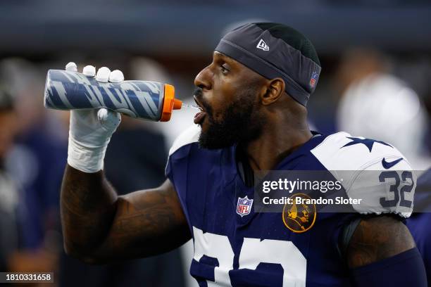 Rashaan Evans of the Dallas Cowboys drinks from a Gatorade water bottle prior to the game against the Washington Commanders at AT&T Stadium on...