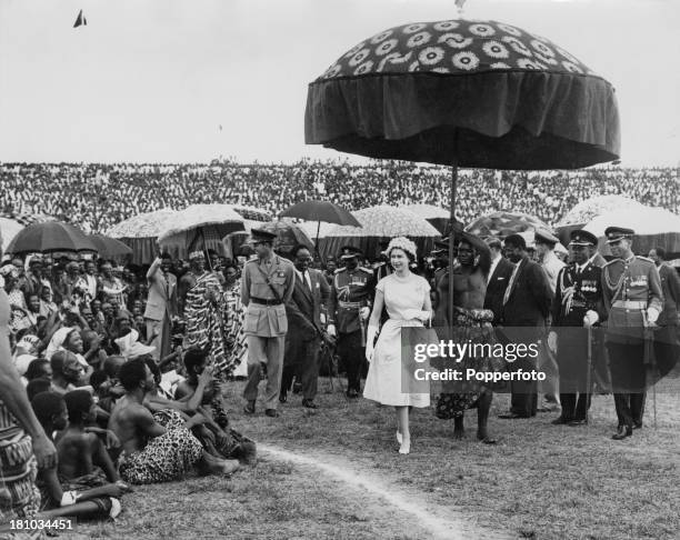 Queen Elizabeth II and the Duke of Edinburgh at Kumasi Sports Stadium in Kumasi, during their Commonwealth Visit to Ghana, 16th November 1961. They...