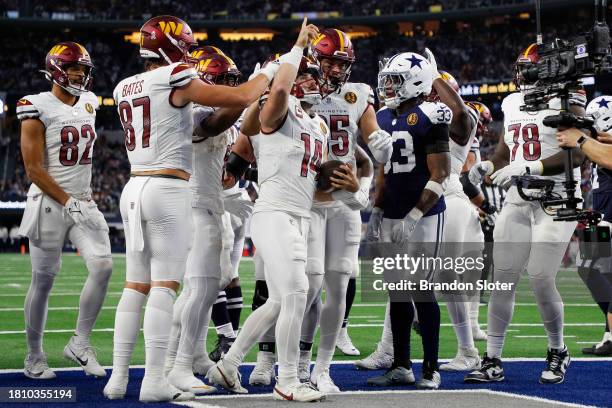 Sam Howell of the Washington Commanders celebrates after a touchdown against the Dallas Cowboys during the first half at AT&T Stadium on November 23,...