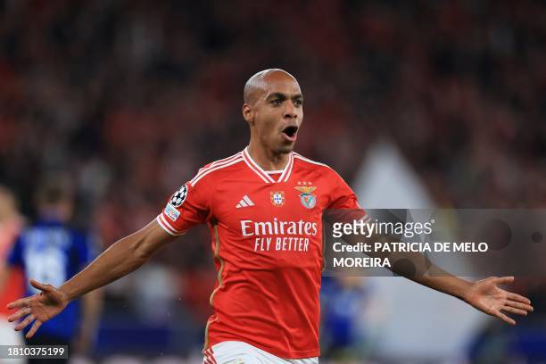 Benfica's Portuguese midfielder Joao Mario celebrates after scoring the opening goal during the UEFA Champions League first round group D football...