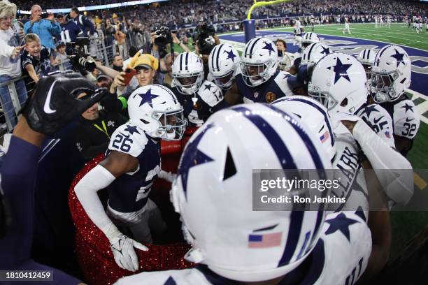 DaRon Bland of the Dallas Cowboys celebrates after an interception returned for a touchdown in the game against the Washington Commanders during the...