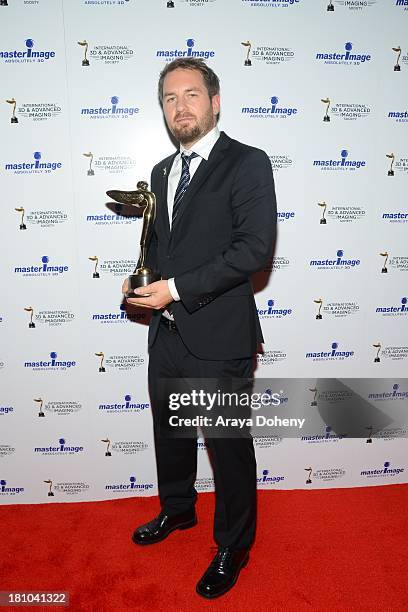 Christian Kuehn receives an award at the International 3D Society & Advanced Imaging Society 3D Products of the Year Awards at Paramount Studios on...