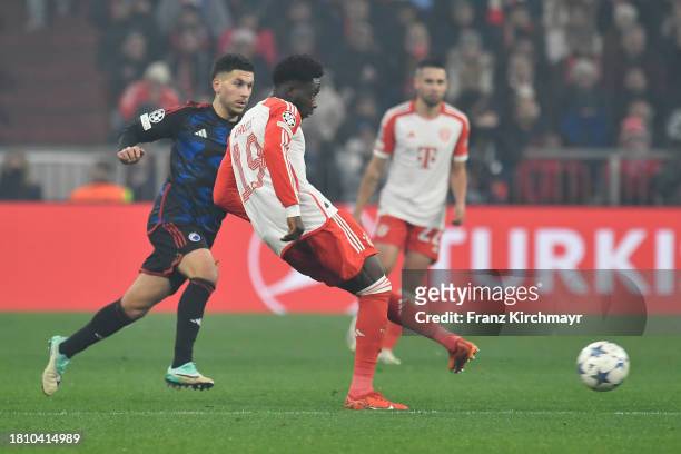 Roony Bardghji of FC Kopenhagen and Alphonso Davies of Bayern Muenchen during the UEFA Champions League match between FC Bayern Muenchen and F.C....