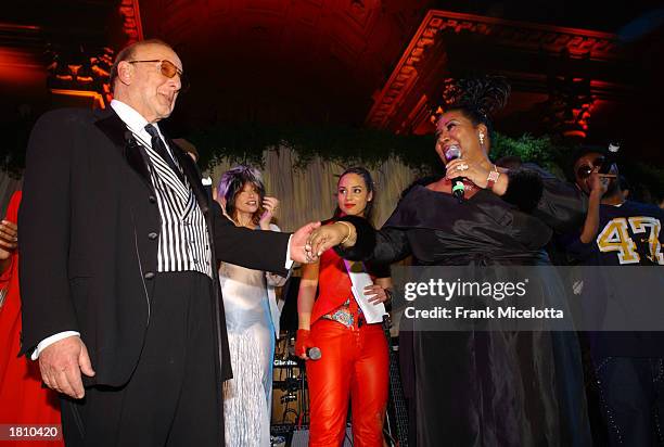 Clive Davis, Carly Simon, Alicia Keys and Aretha Franklin perform onstage during Clive Davis' pre-Grammy Gala at the Regency Hotel's Grand Ballroom...