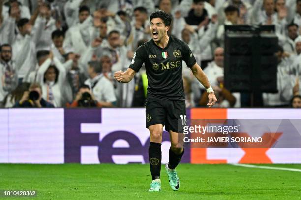 Napoli's Argentine forward Giovanni Simeone celebrates scoring the opening goal during the UEFA Champions League first round group C football match...