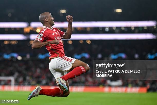 Benfica's Portuguese midfielder Joao Mario celebrates after scoring his team's second goal during the UEFA Champions League first round group D...