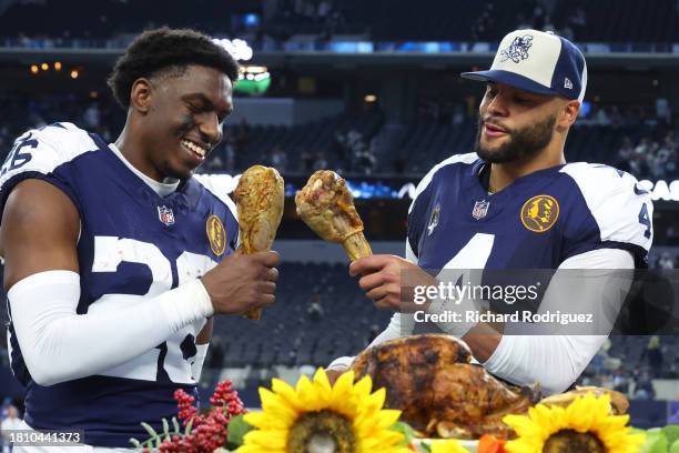 DaRon Bland Dak Prescott of the Dallas Cowboys take a bite out of a turkey leg after a win over the Washington Commanders at AT&T Stadium on November...