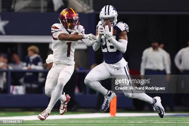 DaRon Bland of the Dallas Cowboys intercepts a pass intended for Jahan Dotson of the Washington Commanders during the fourth quarter at AT&T Stadium...