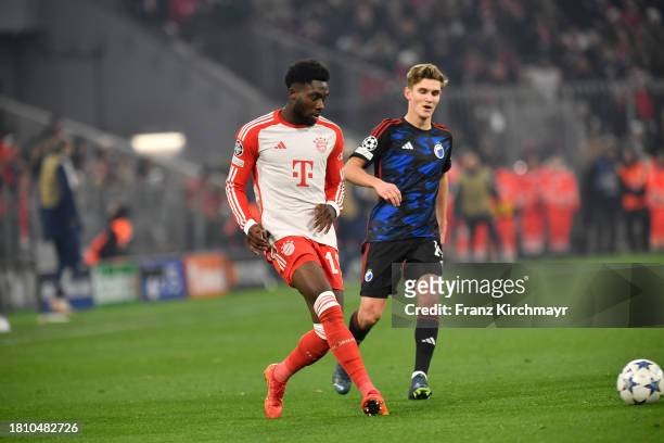 Alphonso Davies of Bayern Muenchen and Elias Jelert of FC Copenhagen during the UEFA Champions League match between FC Bayern Muenchen and F.C....