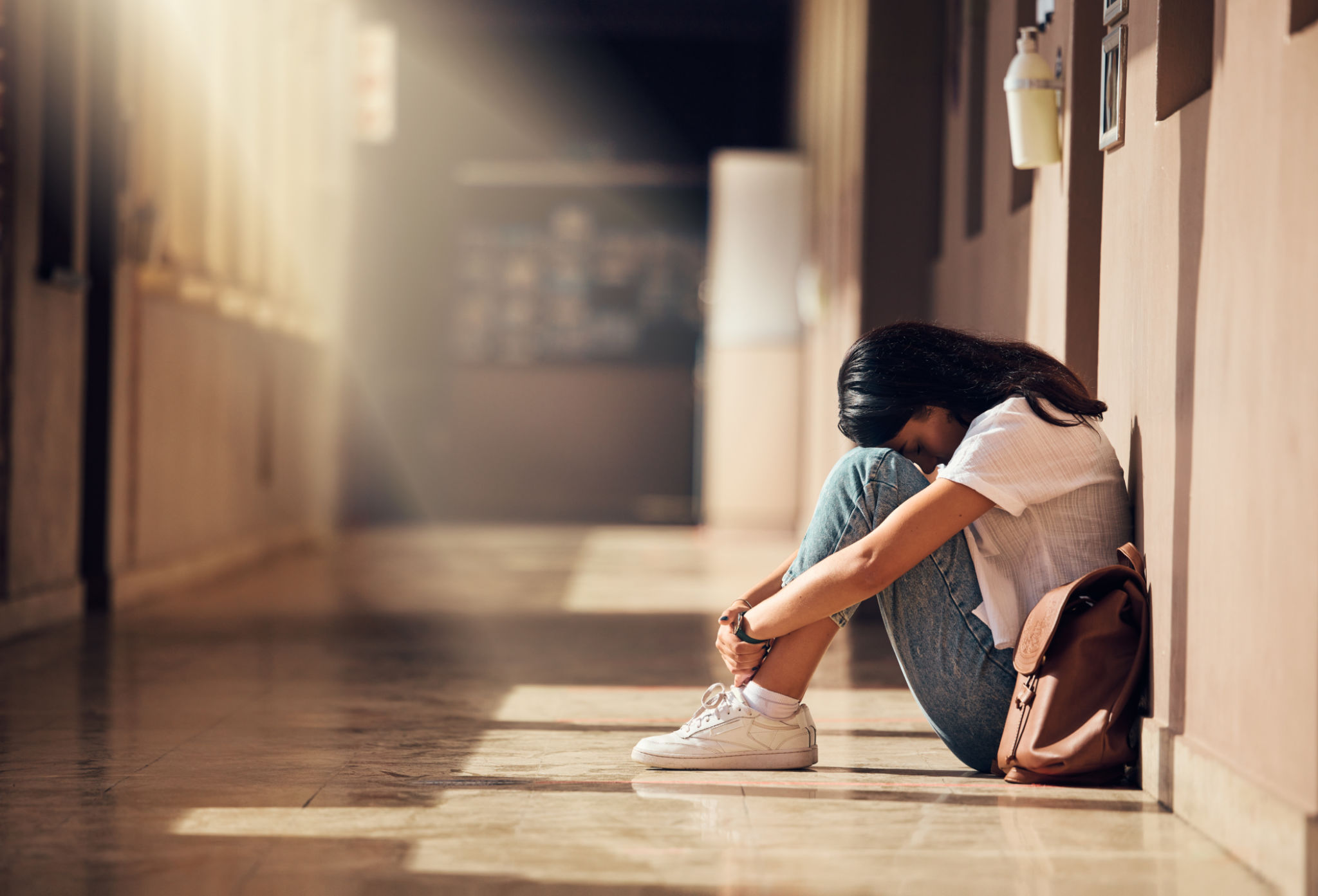 Stress, anxiety and depression of university girl with mental breakdown on campus floor. Frustrated, thinking and depressed indian woman suffering and overwhelmed with burnout at college. Stress, anxiety and depression of university girl with mental breakdown on campus floor. Frustrated, thinking and depressed indian woman suffering and overwhelmed with burnout at college.
