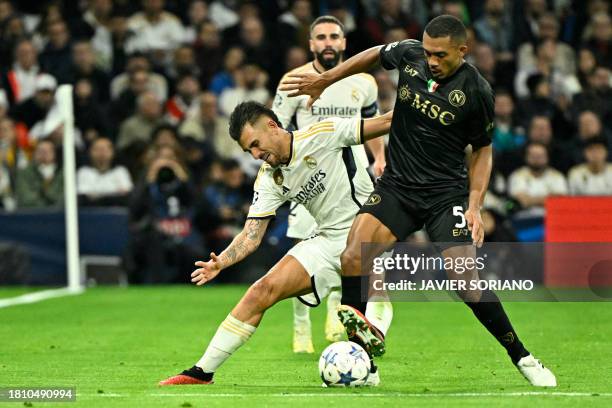 Real Madrid's Spanish midfielder Dani Ceballos vies with Napoli's Brazilian defender Juan Jesus during the UEFA Champions League first round group C...