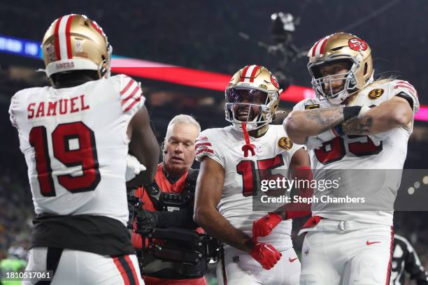 Deebo Samuel of the San Francisco 49ers celebrates a first quarter touchdown with teammates against the Seattle Seahawks at Lumen Field on November...