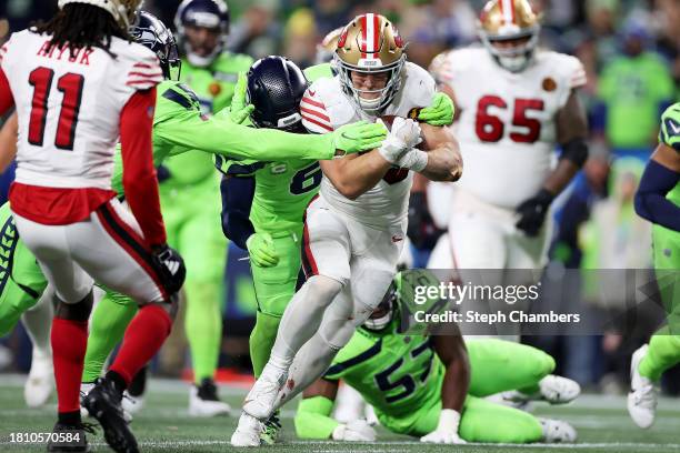 Christian McCaffrey of the San Francisco 49ers scores a touchdown during the second quarter against the Seattle Seahawks at Lumens Field on November...