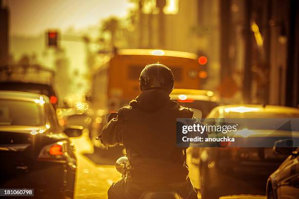 motorcyclist in traffic jam - hollywood california street stock pictures, royalty-free photos & images