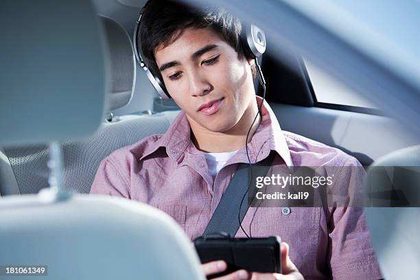 passenger in car using digital tablet - boy playing with cars stock pictures, royalty-free photos & images