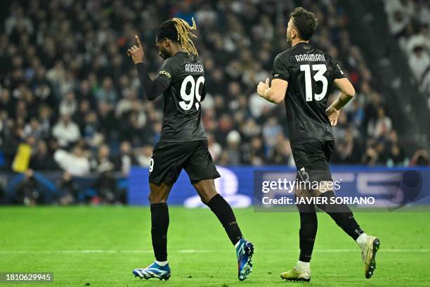 Napoli's Cameroon midfielder Andre Zambo Anguissa celebrates his team's second goal during the UEFA Champions League first round group C football...