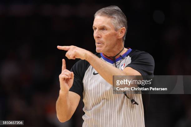 Referee Scott Foster calls a a technical foul during the first half of the NBA game at Footprint Center on November 22, 2023 in Phoenix, Arizona....