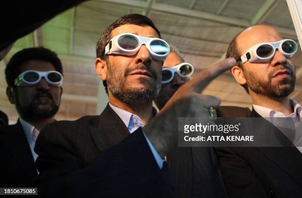Iranian President Mahmoud Ahmadinejad tours an exhibition on laser technology in Tehran on February 7, 2010. Ahmadinejad ordered Iran's atomic chief...