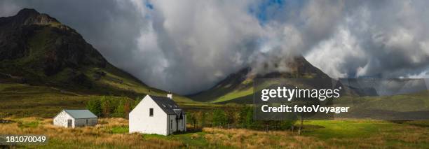 scotland crofters cottage in dramatic highland mountain glen panorama - scotland weather stock pictures, royalty-free photos & images