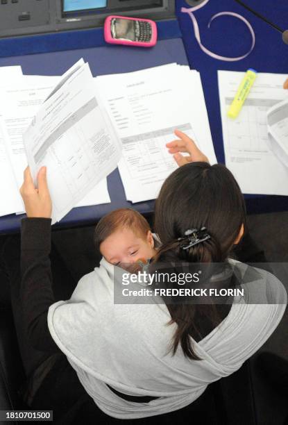 European deputy Licia Ronzulli of Italy looks through papers at the European Parliament in the northeastern French city of Strasbourg as she takes...