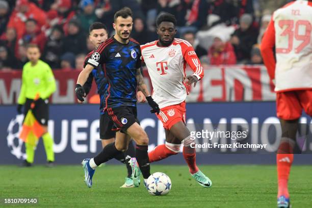Diogo Goncalves of FC Copenhagen and Alphonso Davies of Bayern Muenchen during the UEFA Champions League match between FC Bayern Muenchen and F.C....