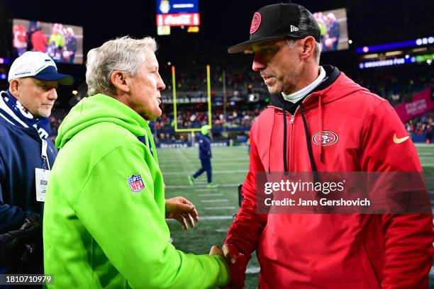 Head coach Pete Carroll of the Seattle Seahawks and head coach Kyle Shanahan of the San Francisco 49ers meet at midfield after the game at Lumen...