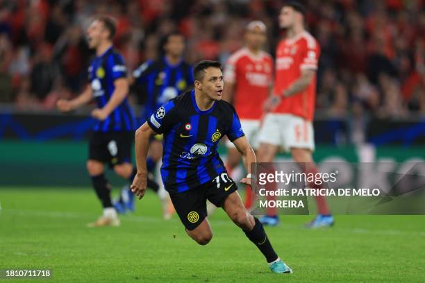 Inter Milan's Chilean forward Alexis Sanchez celebrates after scoring a penalty kick for his team's third goal during the UEFA Champions League first...
