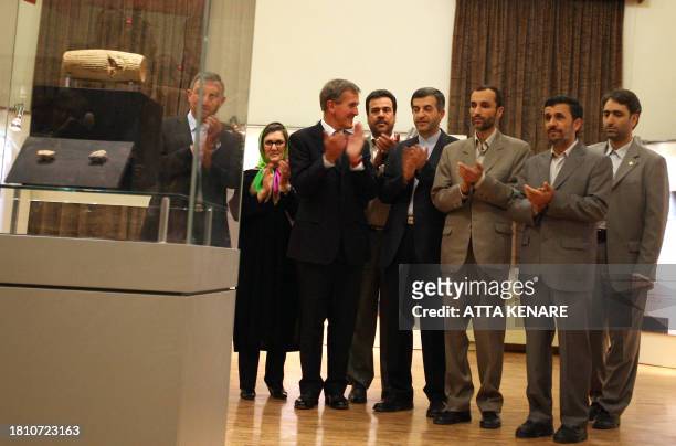 Iranian President Mahmoud Ahmadinejad views the unveiling on the Cyrus Cylinder, at the National Museum of Iran in Tehran on September 12, 2010. The...