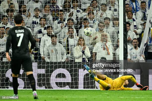 Napoli's Italian goalkeeper Alex Meret concedes athird goal scored by Real Madrid's Argentinian midfielder Nico Paz during the UEFA Champions League...