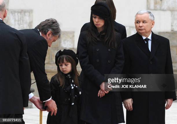 Former Ukrainian President Victor Yushchenko presents his condolences to late Polish President Lech Kaczynski's daughter Marta , grand-daughter Ewa,...