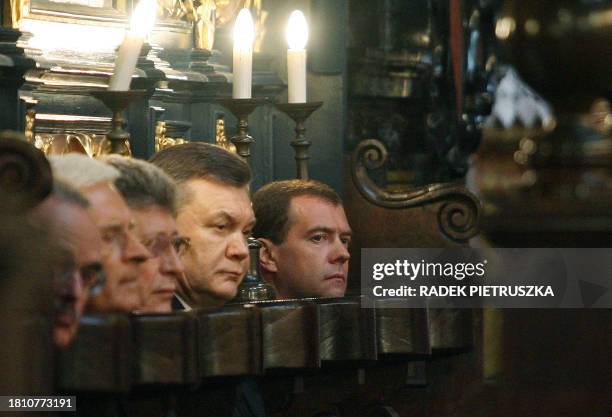 Russian President Dmitry Medvedev, Ukrainian President Viktor Yanukovych attend the funeral mass for late Polish President Lech Kaczynski and his...