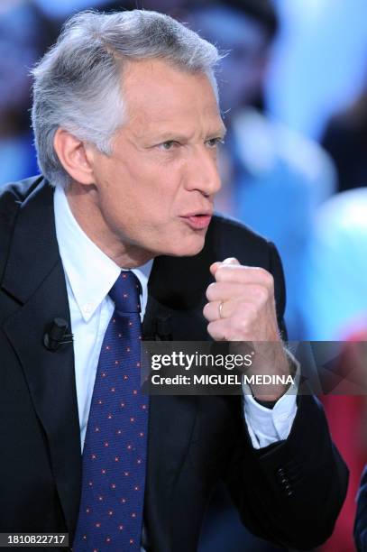 French ex-prime minister Dominique de Villepin speaks and gestures during the "Grand journal" of French TV channel Canal +, on January 29, 2010 in...