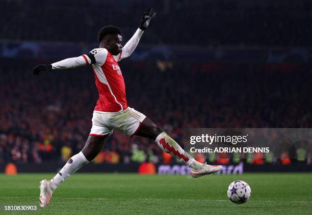 Arsenal's English midfielder Bukayo Saka controls the ball during the UEFA Champions League Group B football match between Arsenal and RC Lens at the...