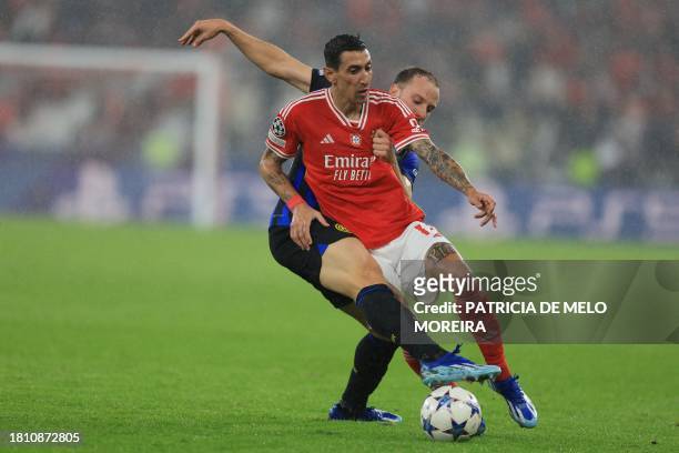 Benfica's Argentinian forward Angel Di Maria fights for the ball with Inter Milan's Brazilian defender Carlos Augusto during the UEFA Champions...