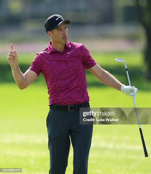 Ross Fisher of England gestures after holing his approach shot on the 13th hole during Day Two of the Joburg Open at Houghton GC on November 24, 2023...