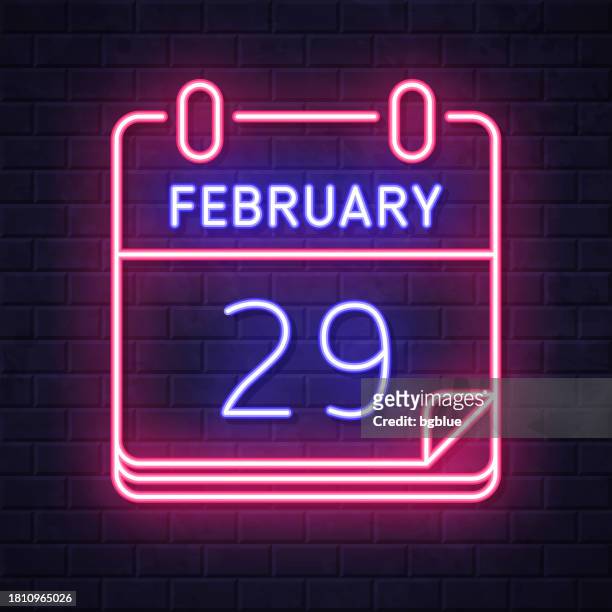 illustrazioni stock, clip art, cartoni animati e icone di tendenza di 29 febbraio. icona al neon incandescente su sfondo muro di mattoni - february