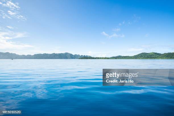 sea with cloud - 山 stock pictures, royalty-free photos & images