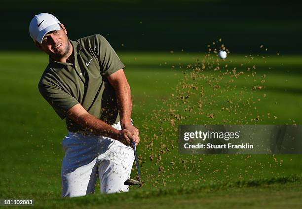 Francesco Molinari of Italy plays a bunker shot during the first round of the Italian Open golf at Circolo Golf Torino on September 19, 2013 in...
