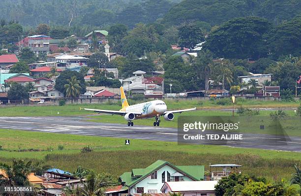 Cebu pacific air passenger plane lands at the airport after flights to and from the city since last week were cancelled due to the stand-off between...