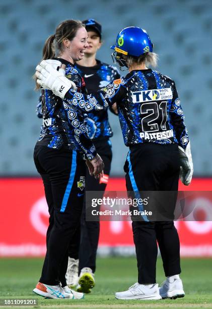 Amanda-Jade Wellington of the Adelaide Strikers and Bridget Patterson of the Adelaide Strikers celebrates the wicket of Chloe Ainsworth of the Perth...