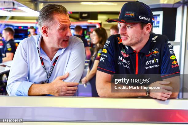 Max Verstappen of the Netherlands and Oracle Red Bull Racing and Jos Verstappen look on in the garage during practice ahead of the F1 Grand Prix of...